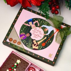Rocking Around the Christmas Tree – Festive Chocolate Box &bull; <span style="font-family: times-new-roman;">Add rhythm to your celebrations with the <em data-start="111" data-end="146">Rocking Around the Christmas Tree</em> <strong data-start="147" data-end="155">350g</strong> chocolate box by Krokinachocolate. Thoughtfully curated and beautifully presented, this festive selection of handcrafted chocolates is inspired by the joy, music, and togetherness of Christmas—perfect for gifting, sharing, and spreading holiday cheer</span>