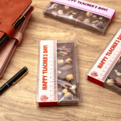 Happy Teachers Day Chocolate Bar Orange &bull; <p data-start="122" data-end="318"><span style="font-family: times-new-roman;">Celebrate the ones who inspire us every day with a sweet gesture. This rich chocolate bar, topped with crunchy nuts and crafted with care, is the perfect little thank you for an amazing teacher.</span></p> <p data-start="320" data-end="375"><span style="font-family: times-new-roman;">Because every lesson deserves a little sweetness</span></p>