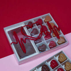 Heart Beat Chocolate Box 3 &bull; <p data-start="392" data-end="749"><span style="font-family: times-new-roman;">Feel the rhythm of love in every bite.</span><br data-start="430" data-end="433" /><span style="font-family: times-new-roman;">The <strong data-start="437" data-end="472">Heart Beat Chocolate Box (300g)</strong> features a refined selection of heart-shaped chocolates paired with a bold heartbeat-designed chocolate bar at the center. Crafted to express passion, romance, and elegance, this box is the perfect gift for Valentine’s Day, anniversaries, or meaningful moments from the heart.</span></p> <p data-start="751" data-end="767"><span style="font-family: times-new-roman;"><strong data-start="751" data-end="762">Weight:</strong> 300g</span></p>