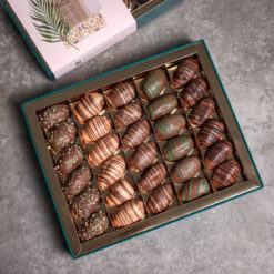 Ramadan Box Mix Dates Collaection 5 &bull; <p data-start="49" data-end="175"><span style="font-family: times-new-roman;">Ramadan selection of premium dates filled with delicious flavors: <em><strong>Lotus, Nutella, Pistachio, Almond, and Halawa.</strong></em></span></p> <p data-start="177" data-end="322" data-is-last-node="" data-is-only-node=""><span style="font-family: times-new-roman;">Beautifully arranged and perfect for gifting or sharing, this <em><strong>900g box</strong></em> brings a rich blend of tradition and indulgence to your Ramadan table</span></p>