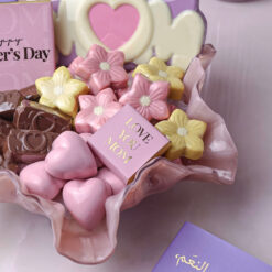 Mothers Day Blossom Chocolate Plate 2 &bull; <span style="font-family: times-new-roman;">Celebrate Mom with our elegant <strong data-start="246" data-end="293">Mother’s Day Blossom Chocolate Plate (700g)</strong> — a luxurious assortment of handcrafted chocolates in beautiful heart and floral shapes. Presented in a premium pink serving plate and featuring special Mother’s Day chocolate messages, this sweet gift is designed to express love, appreciation, and warmth. A perfect Mother’s Day chocolate gift for families looking for a stylish and delicious surprise</span>